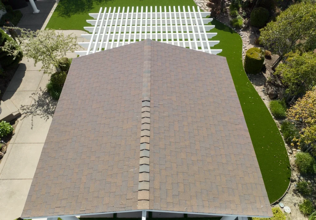 Asphalt shingle roof on a new patio cover, seen from above, by Be Home Remodeling